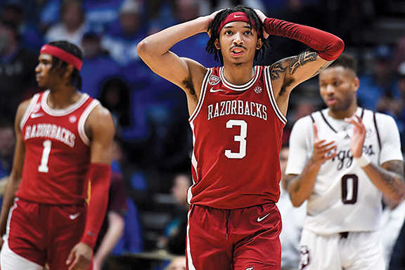 Arkansas Razorbacks guard Nick Smith Jr. reacts after being called for a foul during the second half against the Texas A&M Aggies.